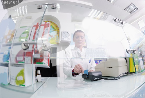 Image of pharmacist suggesting medical drug to buyer in pharmacy drugstor