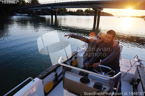 Image of couple in love  have romantic time on boat