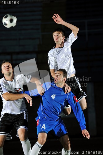 Image of football players in action for the ball