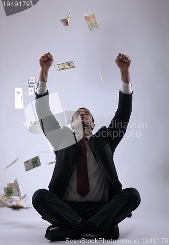 Image of Business man holding money