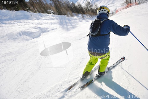 Image of skiing on fresh snow at winter season at beautiful sunny day