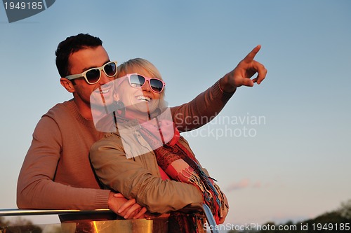 Image of couple in love  have romantic time on boat