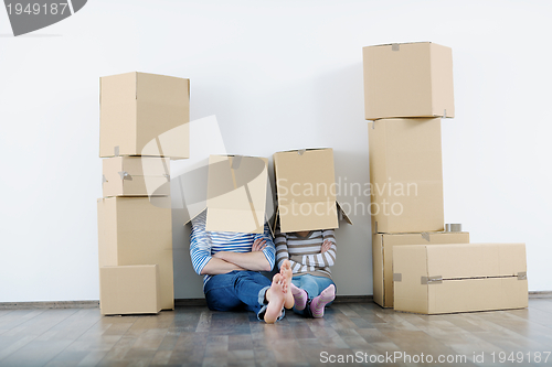 Image of Young couple moving in new house