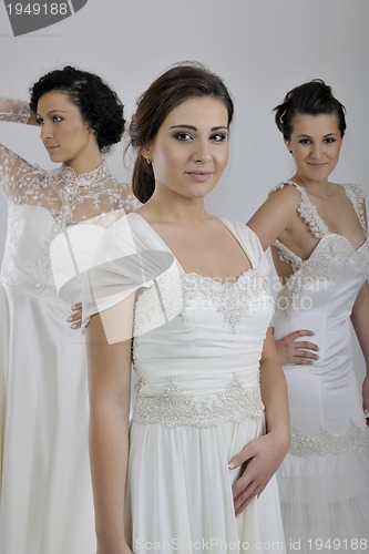 Image of portrait of a three beautiful woman in wedding dress