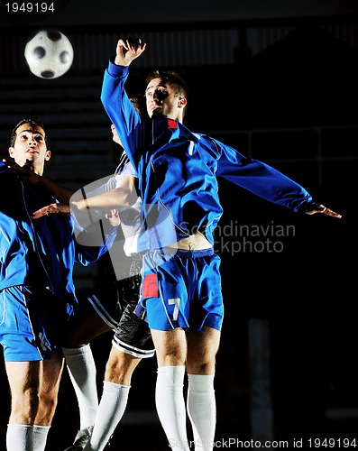 Image of football players in action for the ball