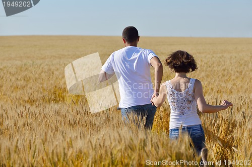 Image of happy couple in wheat field
