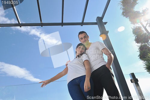 Image of couple relaxing on balcony