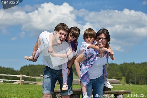 Image of happy young family have fun outdoors