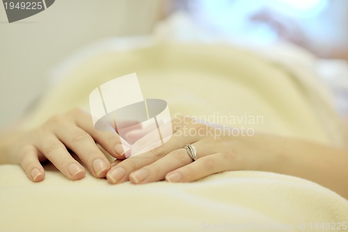 Image of woman with facial mask in cosmetic studio