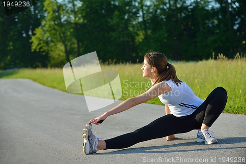 Image of woman stretching before fitness