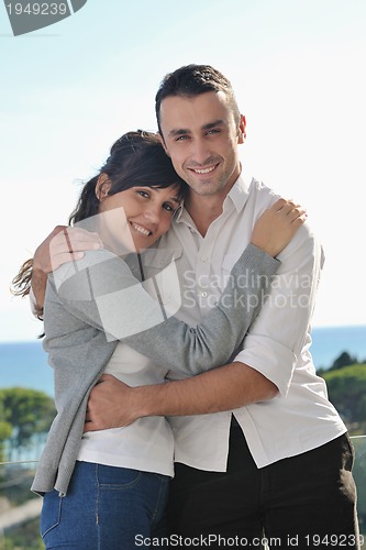 Image of couple relaxing on balcony