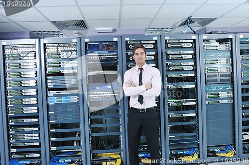 Image of young it engineer in datacenter server room