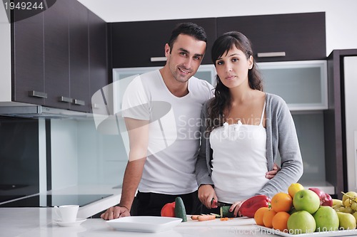 Image of young couple have fun in modern kitchen