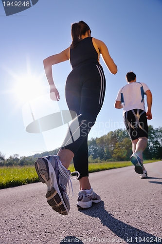 Image of Young couple jogging