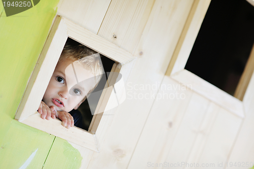 Image of happy child in a window