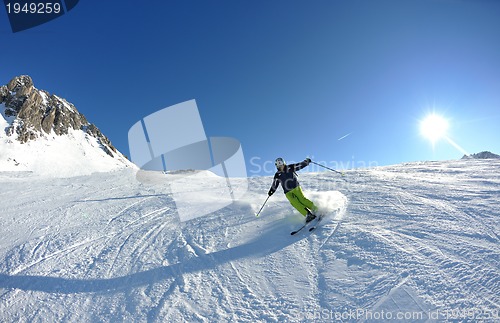 Image of skiing on fresh snow at winter season at beautiful sunny day