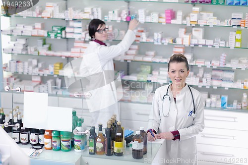 Image of team of pharmacist chemist woman  in pharmacy drugstore