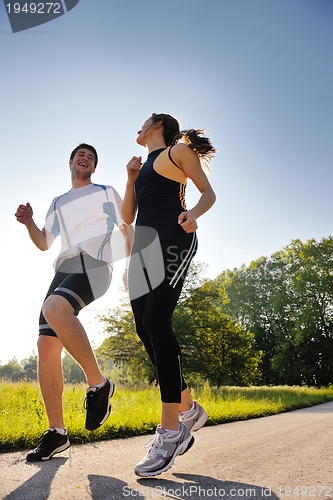 Image of Young couple jogging