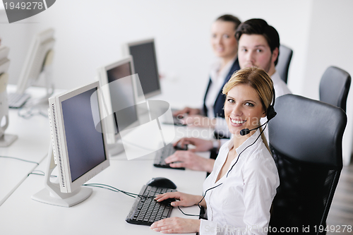 Image of business people group working in customer and help desk office