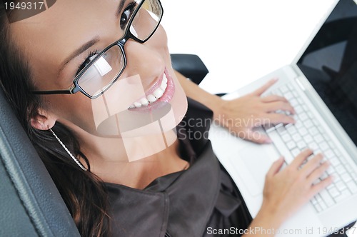Image of business woman with laptop isolated on white