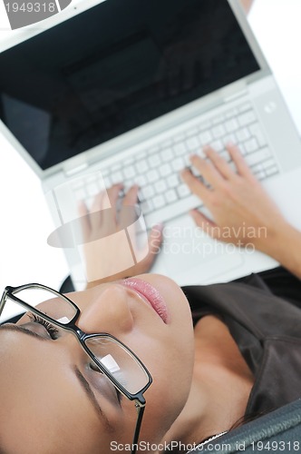 Image of business woman with laptop isolated on white