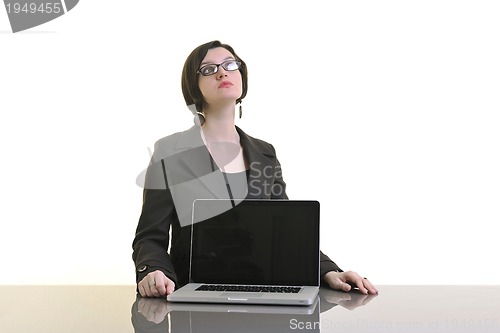 Image of business woman working on laptop isolated on white