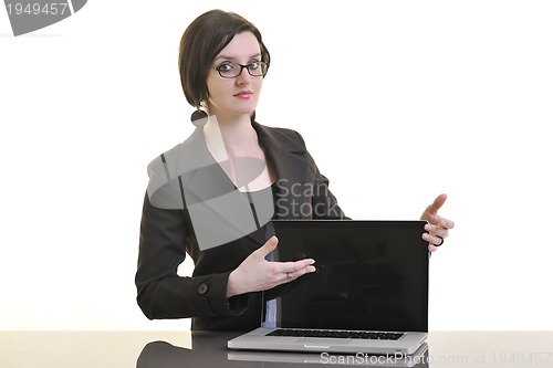 Image of business woman working on laptop isolated on white
