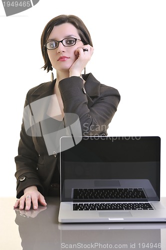 Image of business woman working on laptop isolated on white