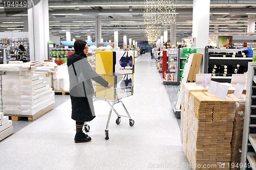 Image of young woman in shopping