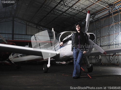 Image of young woman with private airplane