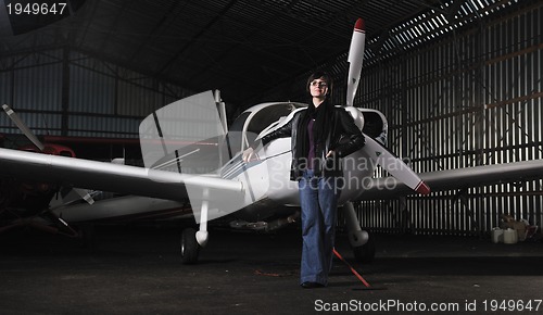 Image of young woman with private airplane