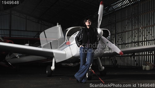 Image of young woman with private airplane