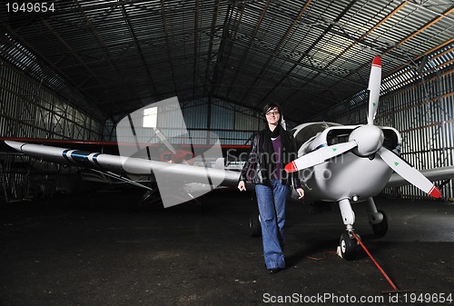 Image of young woman with private airplane