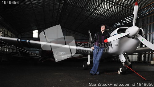 Image of young woman with private airplane