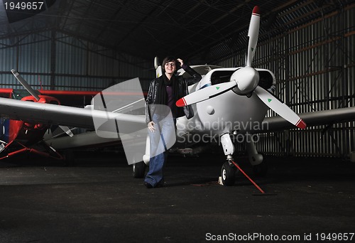 Image of young woman with private airplane