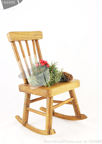 Image of Wooden rocking chair with Christmas decorations