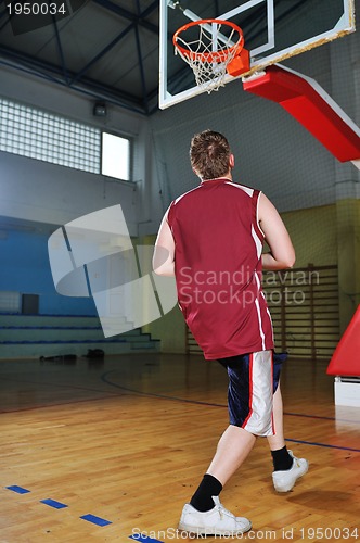 Image of basket ball game player at sport hall