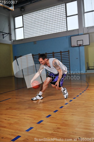 Image of basket ball game player at sport hall