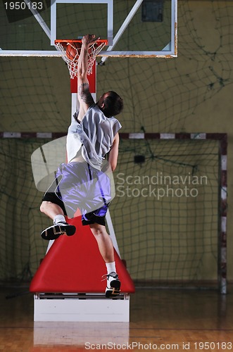 Image of basket ball game player at sport hall