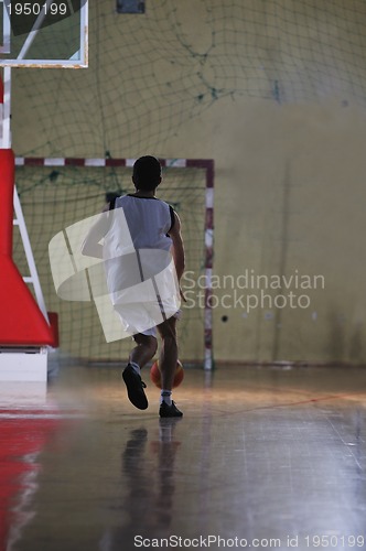 Image of basket ball game player at sport hall
