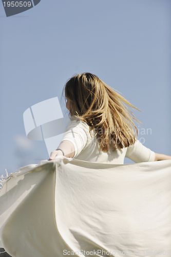 Image of happy young pregnant woman outdoor