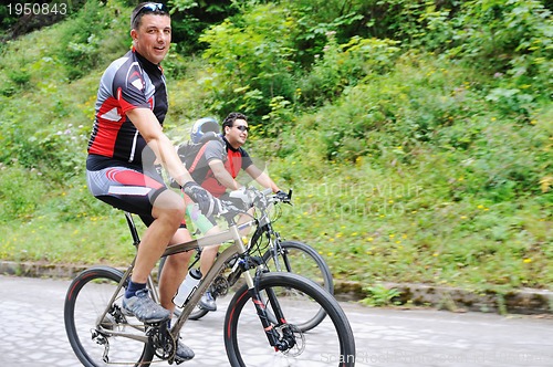 Image of friendshiop outdoor on mountain bike