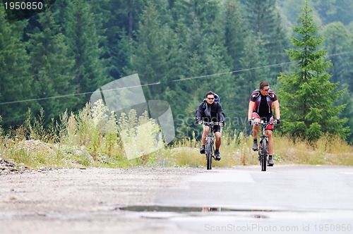 Image of friendshiop outdoor on mountain bike