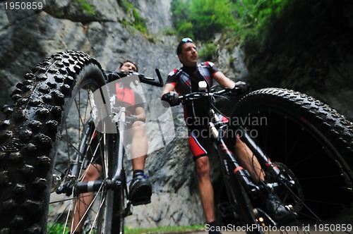 Image of friendshiop outdoor on mountain bike