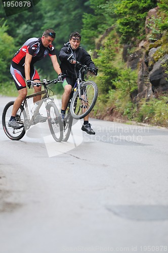 Image of friendshiop outdoor on mountain bike