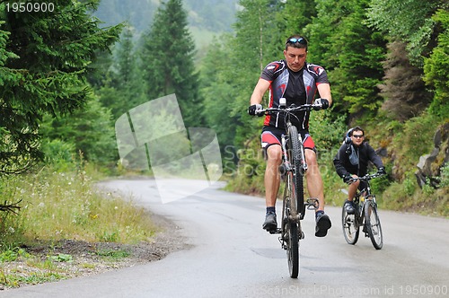 Image of friendshiop outdoor on mountain bike