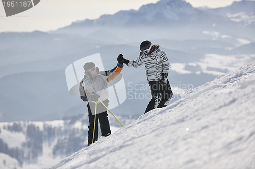 Image of achiving goals on mountain's top