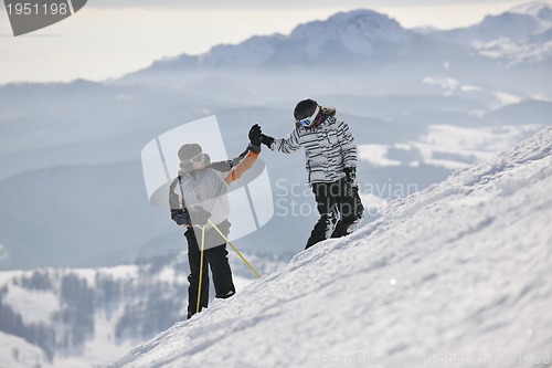 Image of achiving goals on mountain's top