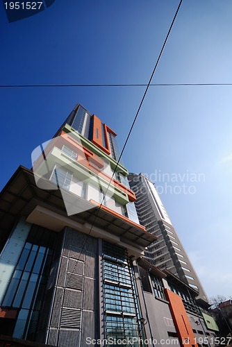 Image of modern building at sunny day and clear blue sky