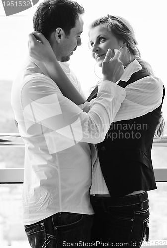 Image of romantic happpy couple on balcony 